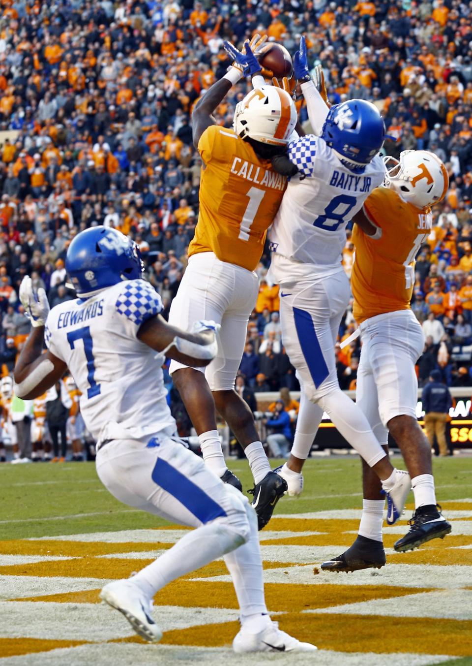 Tennessee wide receiver Marquez Callaway (1) catches a Hail Mary pass for a touchdown while being defended by Kentucky cornerback Derrick Baity Jr. (8) as time expires in the first half of an NCAA college football game Saturday, Nov. 10, 2018, in Knoxville, Tenn. (AP Photo/Wade Payne)