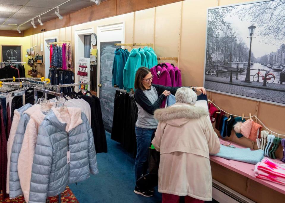 Julie Jackel helps a customer in her store, the Crooked Hem, in Kane, Pennsylvania.