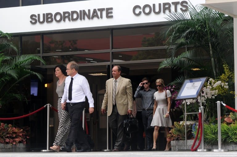 Rick Todd (2nd left), his wife Mary (left) and family members leave the Subordinate Courts in Singapore on Tuesday. The family of a US scientist found hanged last year in Singapore walked out of a coroner's inquiry into his death Tuesday, saying they had "lost faith" in the proceedings