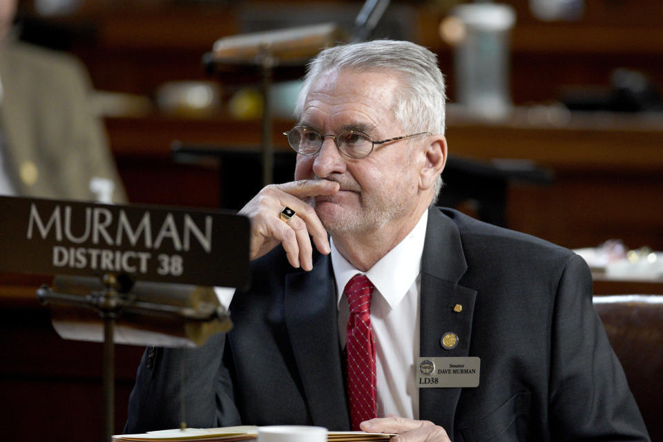 FILE - Nebraska state Sen. Dave Murman, R-Glenvil, sits in the Legislative Chamber in Lincoln, Neb., March 1, 2019. Nebraska lawmakers are considering a bill, introduced by Murman, that would allow teachers and school staff to physically restrain disruptive students and remove them from classrooms without fear of being disciplined, even as critics say physical restraint has been used disproportionately against minority and disabled students. (AP Photo/Nati Harnik, File)