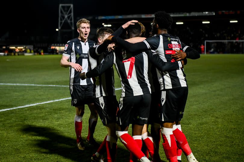 Justin Obikwu scores during the League Two football match between Grimsby Town and MK Dons at Blundell Park