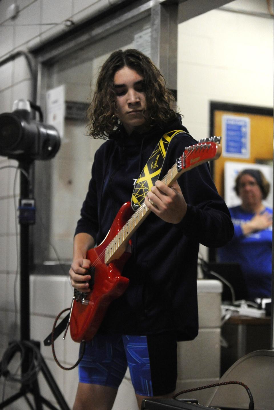 Chillicothe sophomore Tim Kessler performs the national anthem on guitar during the opening ceremony of the Wendy Arth Swim Meet at the Ross County YMCA on Jan. 3, 2024, in Chillicothe, Ohio.