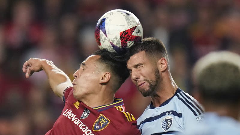 Real Salt Lake forward Rubio Rubin, left, and Sporting Kansas City defender Robert Voloder vie for a head ball during the first half of an MLS soccer match Saturday, Oct. 7, 2023, in Sandy, Utah.