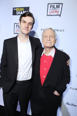 <p>Eric Charbonneau/WireImage</p> Marston Hefner and Hugh Hefner attend "The Rum Diary" premiere in October 2011.