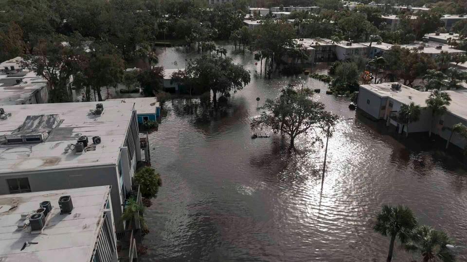 Flood waters sit in an apartment complex Thursday in Clearwater, Florida. ((AP Photo/Mike Stewart))