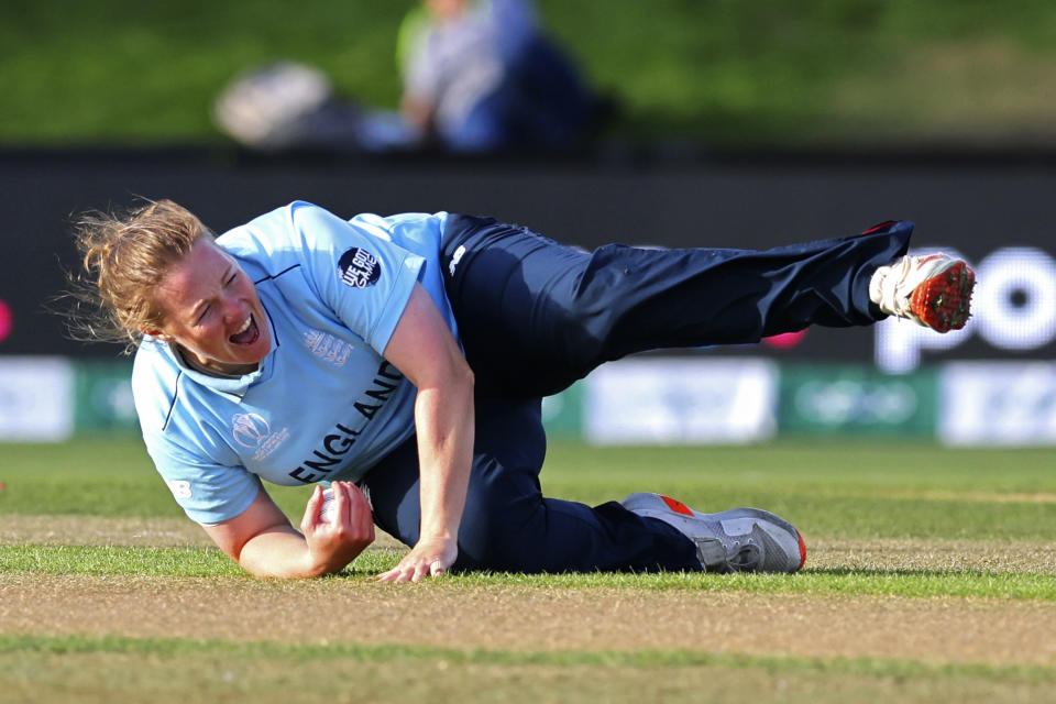 England's Anya Shrubsole celebrates a caught and bowled catch of South Africa's Laura Wolvaardt for no runs during their semifinal of the Women's Cricket World Cup cricket match in Christchurch, New Zealand, Thursday, March 31, 2022. (Martin Hunter/Photosport via AP)