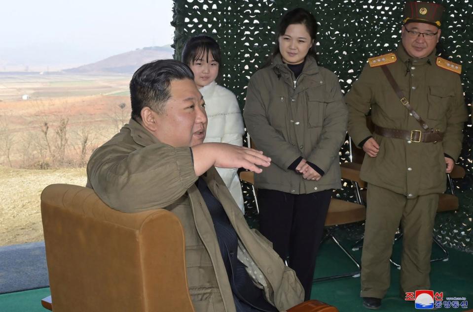 Kim Jong-un, speaks, accompanied by his wife Ri Sol Ju, second from right, and his daughter (AP)