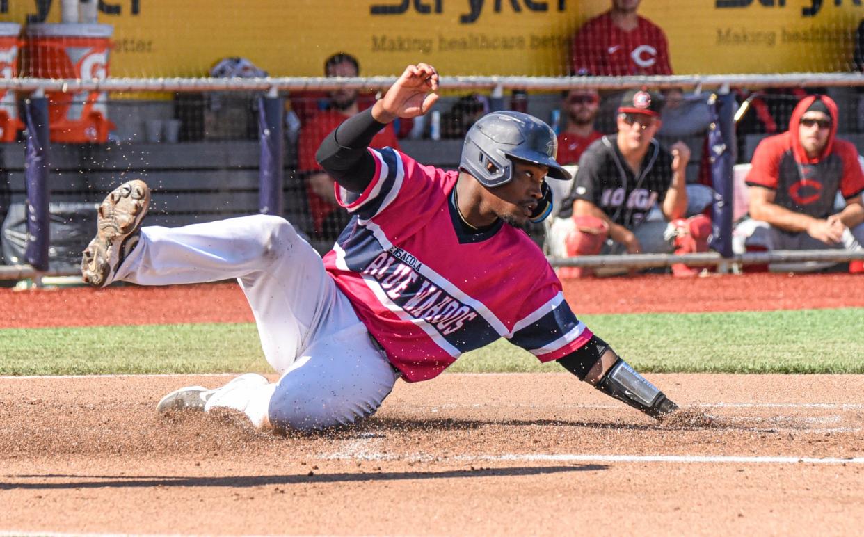 Paul McIntosh slides into home plate with a first inning run Sunday as the Blue Wahoos ended a homestand with five wins in six games against the Chattanooga Lookouts.