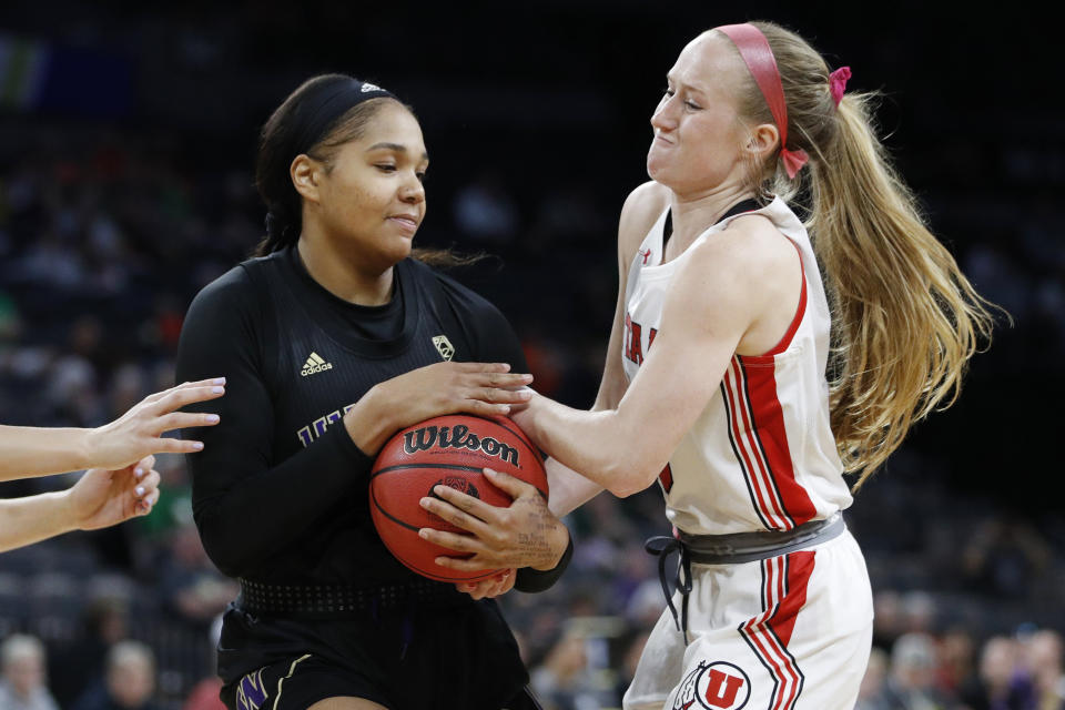 Washington's Quay Miller, left, and Utah's Dru Gylten battle for the ball during the first half of an NCAA college basketball game in the first round of the Pac-12 women's tournament Thursday, March 5, 2020, in Las Vegas. (AP Photo/John Locher)