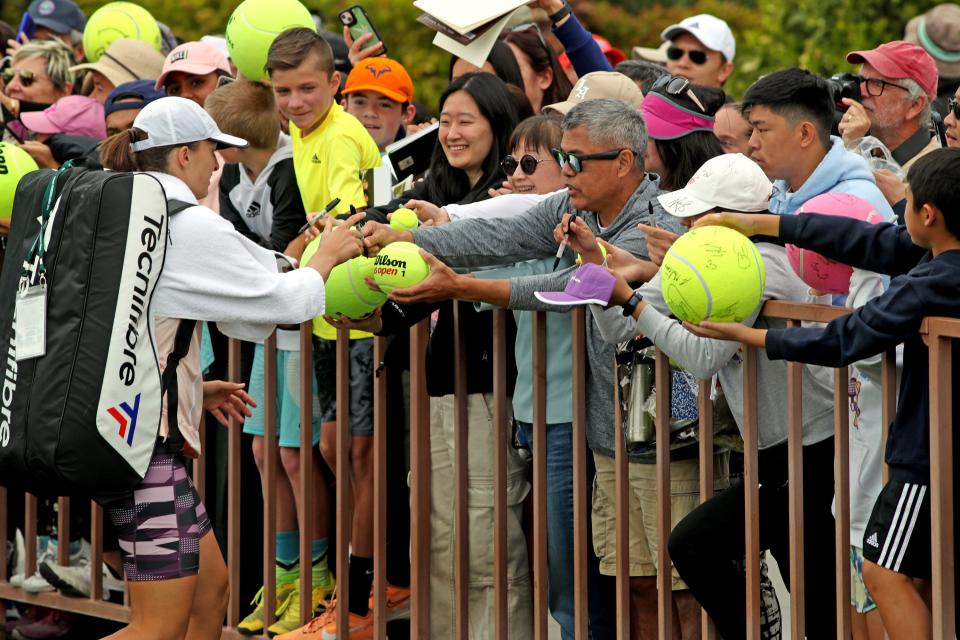 Defending champion Iga Swiatek greets fans during day one of the BNP Paribas Open at the Indian Wells Tennis Garden in Indian Wells, Calif., on Monday, March 6, 2023.
