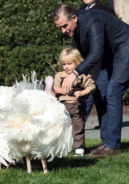 WASHINGTON, DC - NOVEMBER 21: Hunter Biden, the son U.S. President Joe Biden, holds his son Beau as they arrive for the National Thanksgiving Turkey pardoning ceremony on the South Lawn of the White House November 21, 2022 in Washington, DC. The National Thanksgiving Turkey and the alternate were raised at Circle S. Ranch, outside of Charlotte, North Carolina, and will reside on the campus of North Carolina State following today's ceremony. (Photo by Win McNamee/Getty Images)