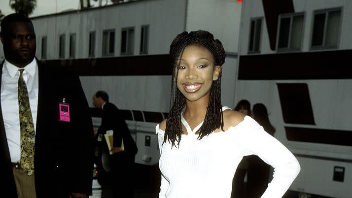 best 90s fashion trends, woman, brandy, wearing black and white swirl patterned pants