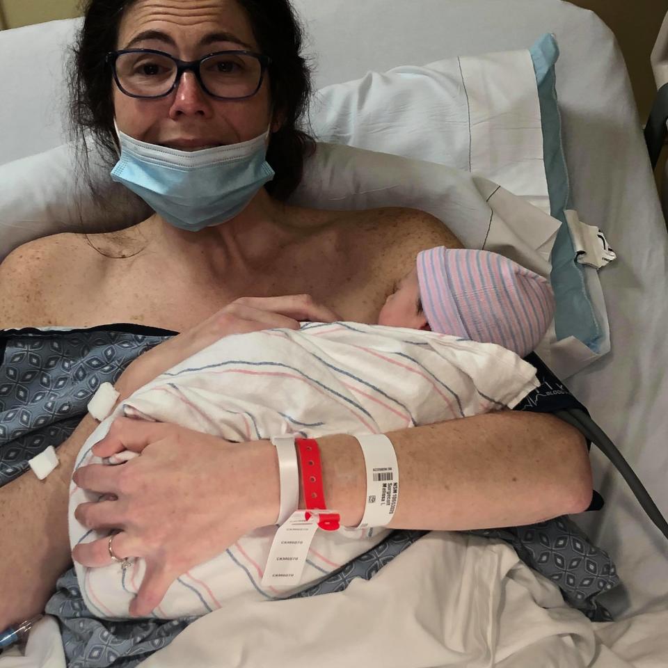 Melissa Surgecoff holds her son, Liam, at Salem Hospital in Boston. The new mother was unaware she pregnant when she gave birth at home on March 8.