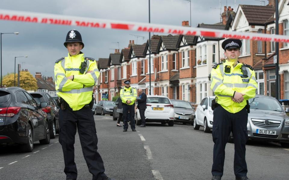 The terraced house in Harlesden Road, Willesden, where police shot a woman in her 20s during a terror raid last night. - Credit: Geoff Pugh 