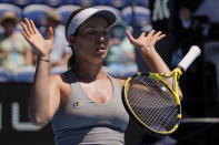 Danielle Collins of the U.S. bounces the racket in frustration during her quarterfinal match against Alize Cornet of France at the Australian Open tennis championships in Melbourne, Australia, Wednesday, Jan. 26, 2022. (AP Photo/Simon Baker)