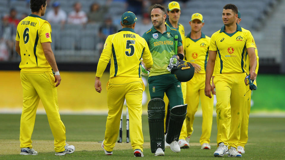 Aaron Finch congratulates Faf du Plessis after South Africa won by 6 wickets. (Photo by David Woodley/Action Plus via Getty Images)