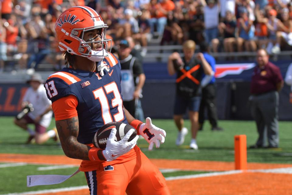 Illinois Fighting Illini wide receiver Pat Bryant (13) scores a touchdown against the Central Michigan Chippewas during the first half at Memorial Stadium on Saturday in Champaign, Illinois.