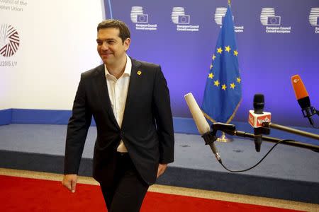 Greek Prime Minister Alexis Tsipras leaves the European Commission after a meeting ahead of a Eurozone emergency summit on Greece in Brussels, Belgium early June 23, 2015. REUTERS/Charles Platiau