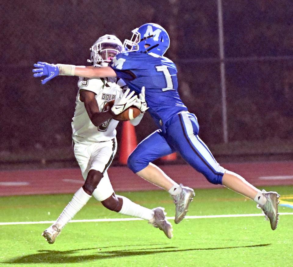 Shemar Dillon of D-Y makes a touchdown catch covered by Ryan Triveri of Mashpee.