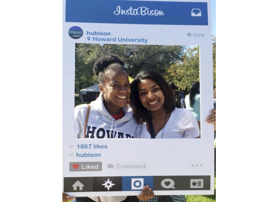 In this October 2014 photo provided by Nerdwallet, Takiia Anderson, left, poses for a photo with her daughter Taje Perkins during a campus visit to Anderson’s alma mater, Howard University in Washington. Today, Anderson’s student debt is long gone. She has nearly $500,000 in retirement savings, and her daughter, Taje Perkins, finished her third year at Spelman College in Atlanta with no student loans to cover its nearly $30,000 per year in tuition and fees. (Nerdwallet via AP)