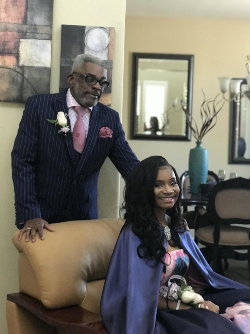 Alvin Hackett, 67, poses with his granddaughter before her senior prom. (Credit: Kaylah Bell)