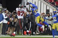 Los Angeles Rams safety Nick Scott (33) intercepts a pass intended for Tampa Bay Buccaneers tight end Rob Gronkowski (87) during the first half of an NFL divisional round playoff football game Sunday, Jan. 23, 2022, in Tampa, Fla. (AP Photo/Jason Behnken)