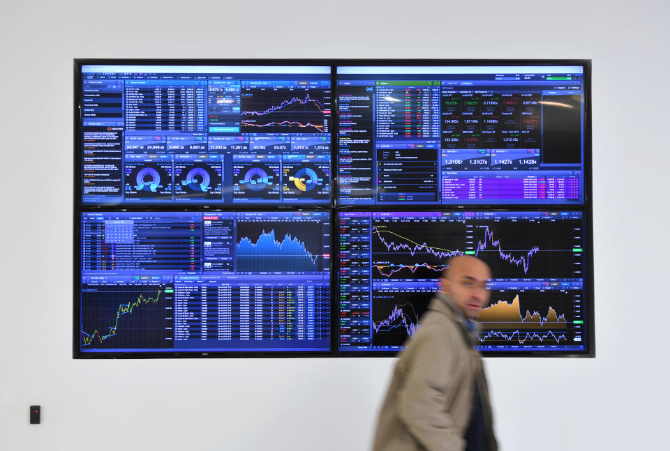 Stocks Sell in May A man walks past a screen displaying share prices following a vote on Prime Minister Theresa May's Brexit 'plan B' at CMC Markets in London, Britain, January 30, 2019. REUTERS/Dylan Martinez