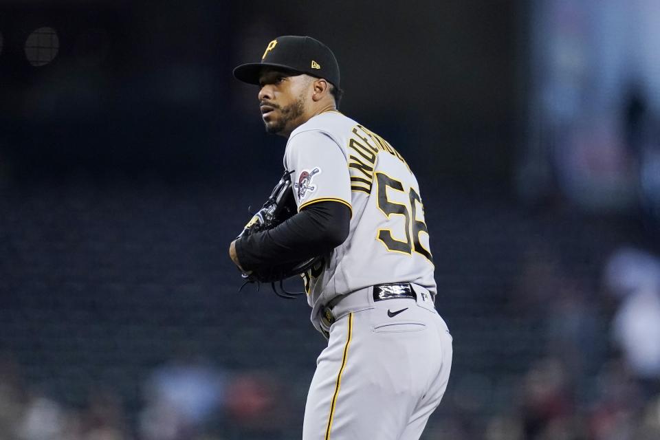 Pittsburgh Pirates relief pitcher Duane Underwood Jr. pauses on the mound after giving up a home run to Arizona Diamondbacks' Pavin Smith during the seventh inning of a baseball game Wednesday, July 21, 2021, in Phoenix. The Diamondbacks won 6-4. (AP Photo/Ross D. Franklin)