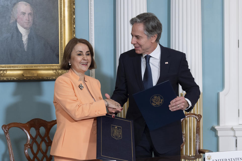 Secretary of State Antony Blinken and Romanian Foreign Minister Luminița-Teodora Odobescu shake hands after signing a memorandum of understanding during a ceremony in the Treaty Room at the State Department, Friday, June 21, 2024, in Washington. (AP Photo/Manuel Balce Ceneta)