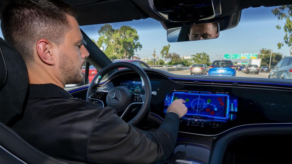 mercedes drive pilot driver playing shuffle puck