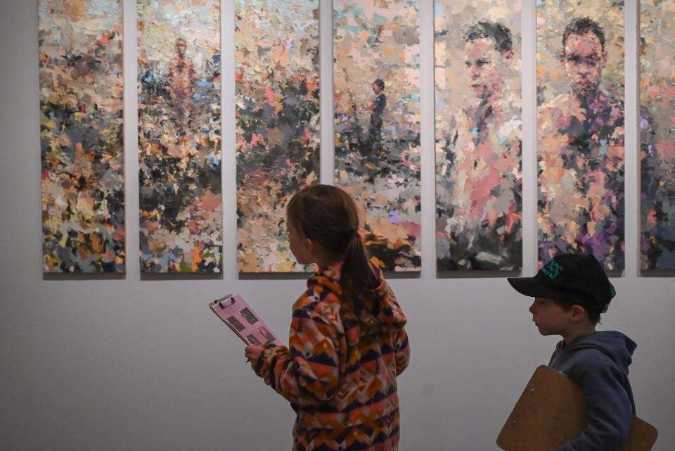 Young children walk past Joshua Meyer's "Eight Approaches" at the Worcester Art Museum.