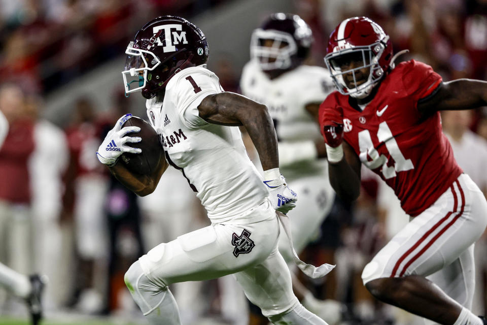 Oct 8, 2022; Tuscaloosa, Alabama; Texas A&M Aggies wide receiver Evan Stewart (1) carries the ball against Alabama Crimson Tide during the first half at Bryant-Denny Stadium. Butch Dill-USA TODAY Sports