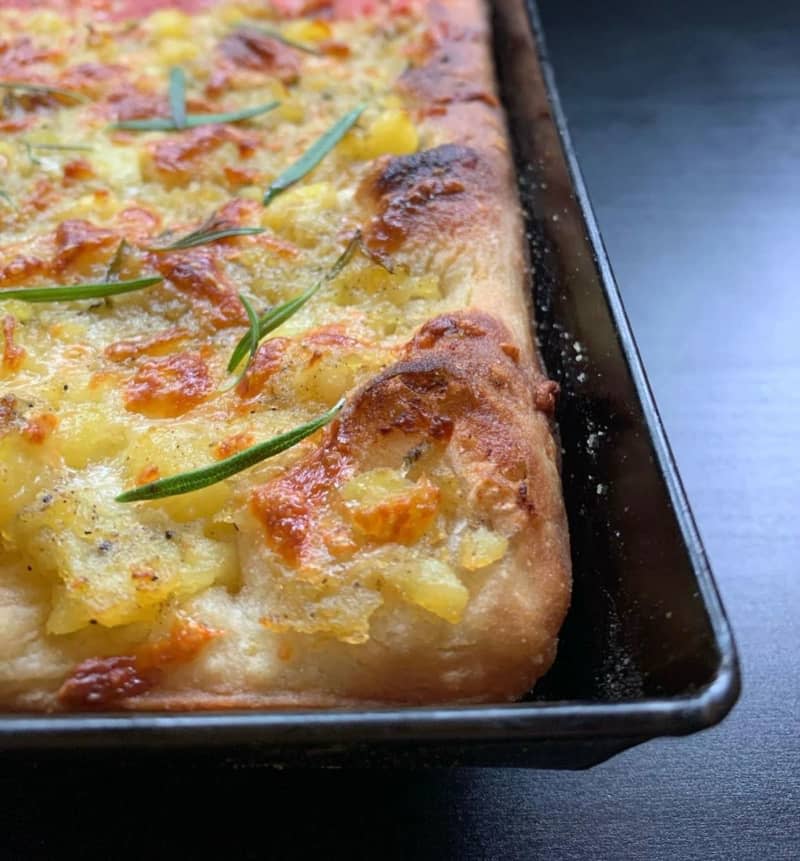 It may sound unusual, controversial or even taboo, but potatoes on pizza actually work great if you're using a tray-baked pizza recipe. They just go well with this fluffier dough - which also works with any normal domestic oven. Julia Ma/manopasto/dpa