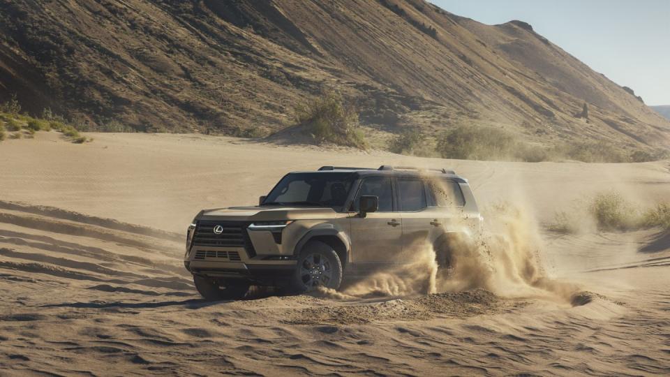 a truck driving through a dirt road