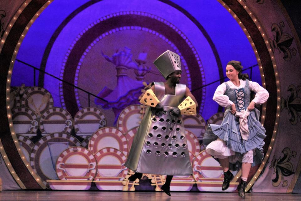 Belle (Lauren McDonald) shares a few nifty dance steps with a cheese grater (Jeremiah Taylor) in Abilene Christian University's  2019 production of "Beauty and the Beast."