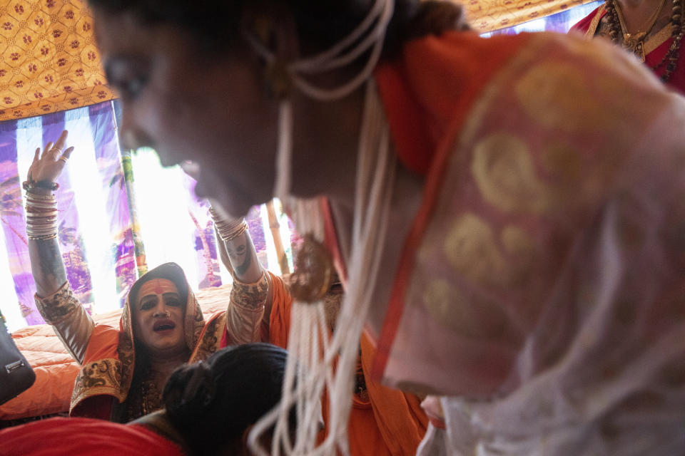 In this Jan. 14, 2019, photo, Laxmi Narayan Tripathi, an Indian transgender activist and leader of the "Kinnar akhara" monastic order, celebrates the invitation by the "Juna Akhad"' to take part in the Kumbh’s first royal bath, a sadhu-led procession into the river on Jan. 15, during the Kumbh Mela festival in Prayagraj, India. Kinnars celebrated their inclusion at Kumbh as a victory, but their greater acceptance by Hinduism’s most powerful leaders, in the religious and political spheres, remains to be seen. Unlike other akharas, which are only open to Hindu men, Kinnar, founded in 2015, is open to all genders and religions. (AP Photo/Bernat Armangue)