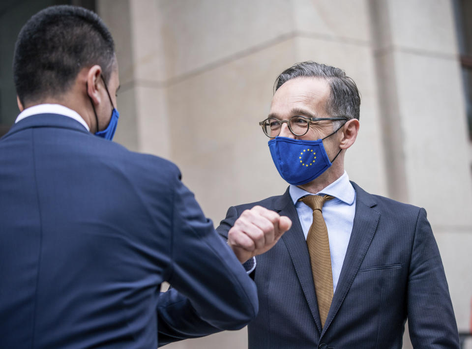 German Foreign Minister Heiko Maas, right, and his Italian counterpart Luigi Di Maio wear face masks to protect against the coronavirus during a meeting at the Foreign Office in Berlin, Germany, Friday, June 5, 2020. (Michael Kappeler/Pool via AP)