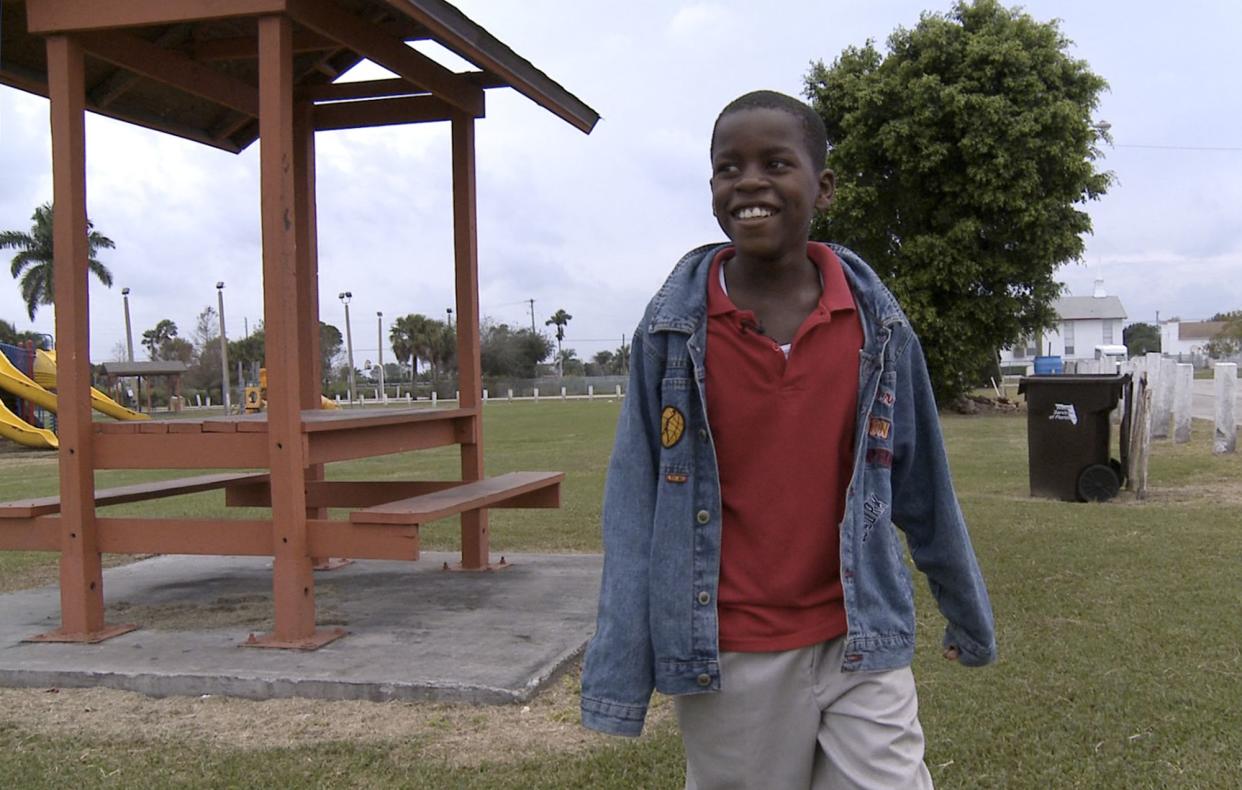 In this Jan. 13, 2009 file photo, Damon Weaver, 10, walks in a park near his home in Pahokee, Fla. 