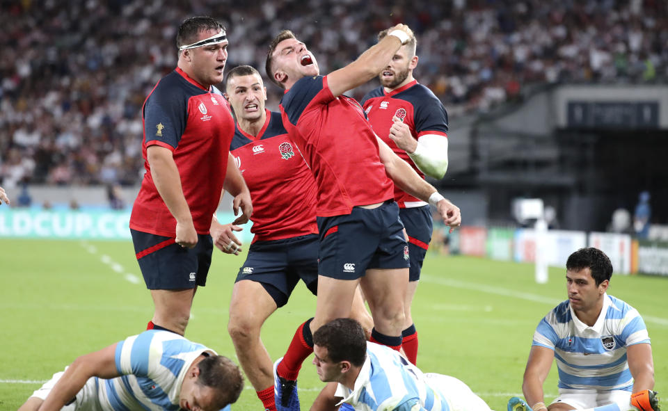 England's George Ford celebrates after scoring a try during the Rugby World Cup Pool C game at Tokyo Stadium between England and Argentina in Tokyo, Japan, Saturday, Oct. 5, 2019. (AP Photo/Eugene Hoshiko)