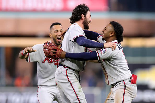 HOUSTON, TEXAS - NOVEMBER 02:  Dansby Swanson #7 of the Atlanta Braves celebrates with Ozzie Albies #1 after their 7-0 victory against the Houston Astros in Game Six to win the 2021 World Series at Minute Maid Park on November 02, 2021 in Houston, Texas. (Photo by Carmen Mandato/Getty Images)