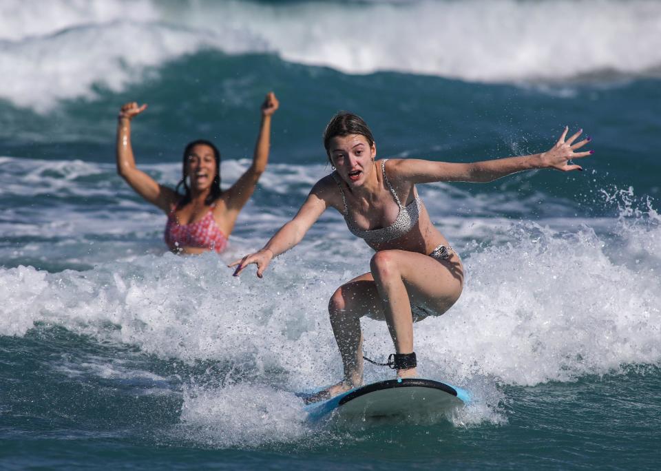 Instructor Mary Glazier could not be more excited to see her first-time student, Victoria Adams,17, riding a wave during her very first lesson March 31, 2022.