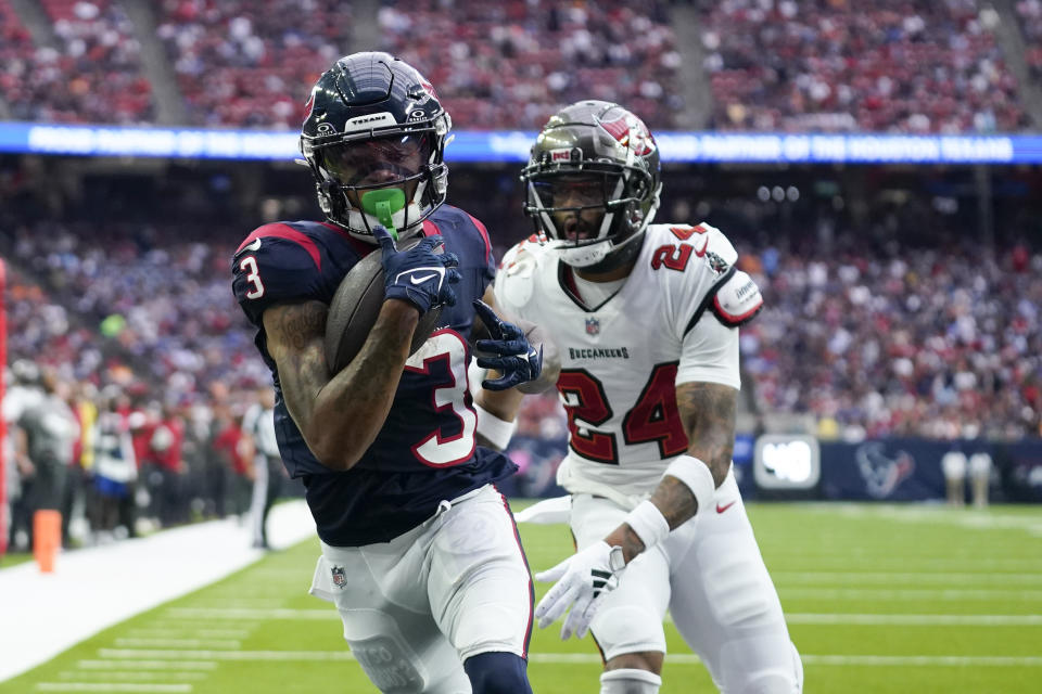 Houston Texans wide receiver Tank Dell (3) collects a touchdown catch in front of Tampa Bay Buccaneers cornerback Carlton Davis III (24) during the second half of an NFL football game, Sunday, Nov. 5, 2023, in Houston. (AP Photo/Eric Gay)