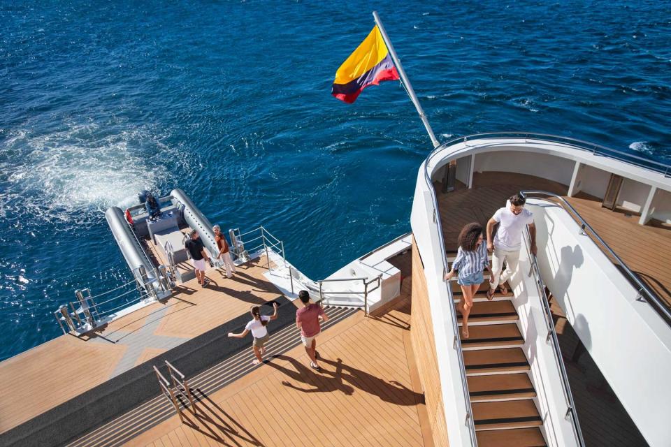 Guests on the deck of the Celebrity Flora cruise ship, in the Galapagos islands