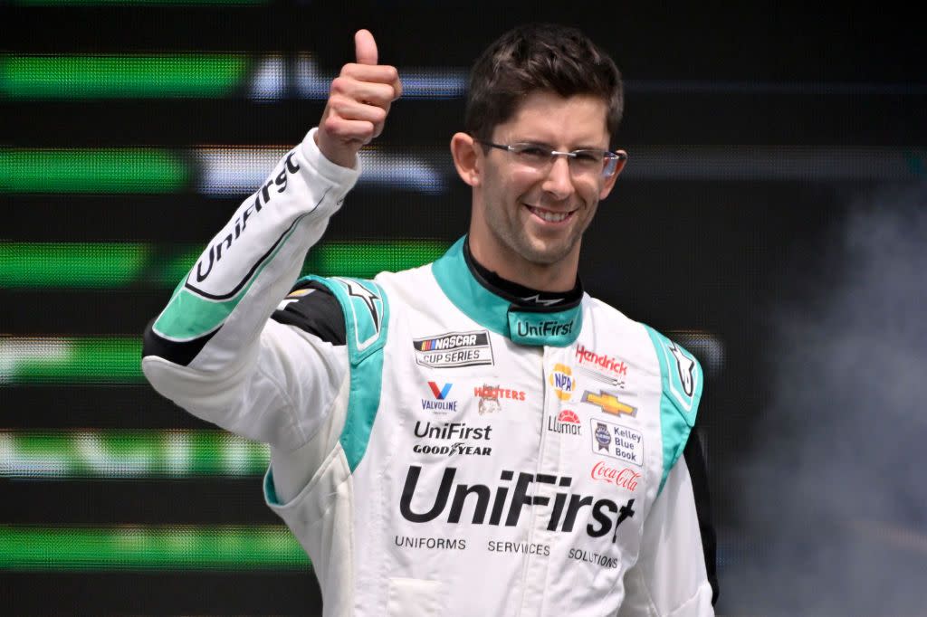 austin, texas march 26 jordan taylor, driver of the 9 unifirst chevrolet, gives a thumbs up as he walks onstage during driver intros prior to the nascar cup series echopark automotive grand prix at circuit of the americas on march 26, 2023 in austin, texas photo by logan rielygetty images