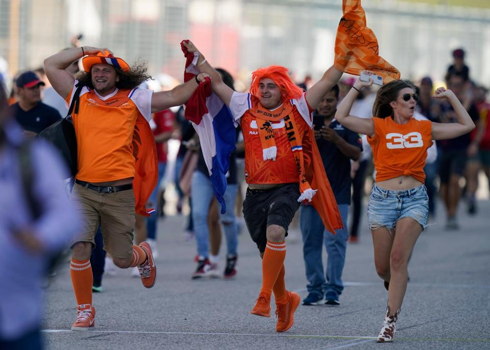 Fans storm the track after Red Bull driver Max Verstappen won the Formula One U.S. Grand Prix auto race at Circuit of the Americas