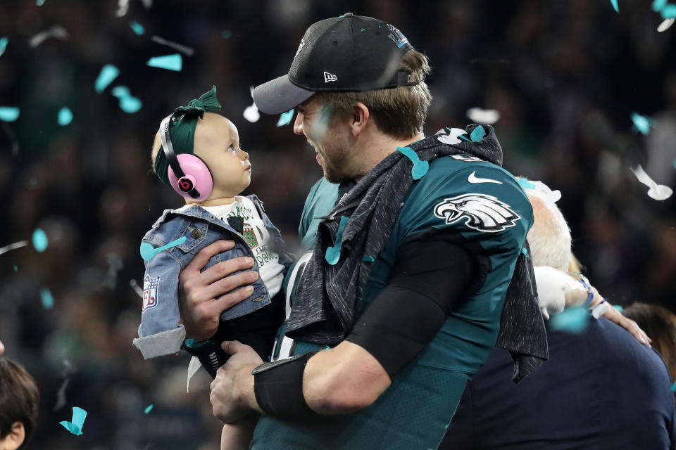 <p>Nick Foles #9 of the Philadelphia Eagles celebrates with his daughter Lily Foles after his 41-33 victory over the New England Patriots in Super Bowl LII at U.S. Bank Stadium on February 4, 2018 in Minneapolis, Minnesota. The Philadelphia Eagles defeated the New England Patriots 41-33. (Photo by Rob Carr/Getty Images) </p>