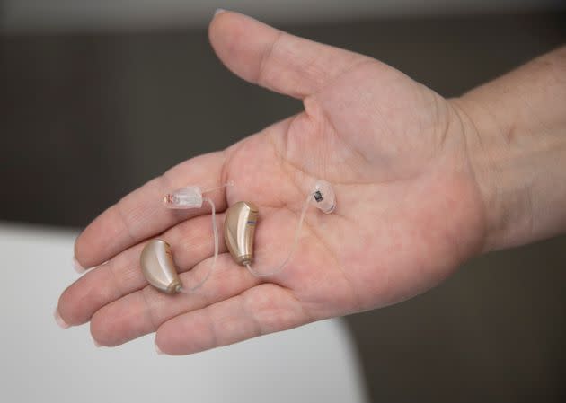 BOCA RATON, FLORIDA - OCTOBER 19: Jennifer Nealon, Marketing Director at Hear Again America, holds hearing aids that they sell on October 19, 2021 in Boca Raton, Florida. The Food and Drug Administration announced that people with mild or moderate hearing loss could soon buy hearing aids without a medical exam or special fitting. The agency says 37.5 million American adults have difficulties hearing. (Photo by Joe Raedle/Getty Images) (Photo: Joe Raedle via Getty Images)