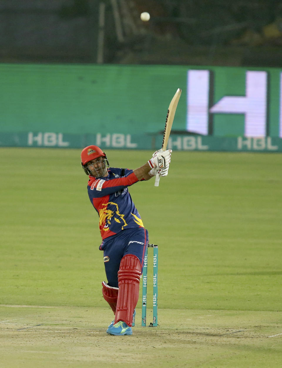 Karachi Kings Mohammad Nabi plays a shot for six during a Pakistan Super League T20 cricket match between Karachi Kings and Quetta Gladiators at National Stadium, in Karachi, Pakistan, Saturday, Feb. 20 2021. (AP Photo/Fareed Khan)