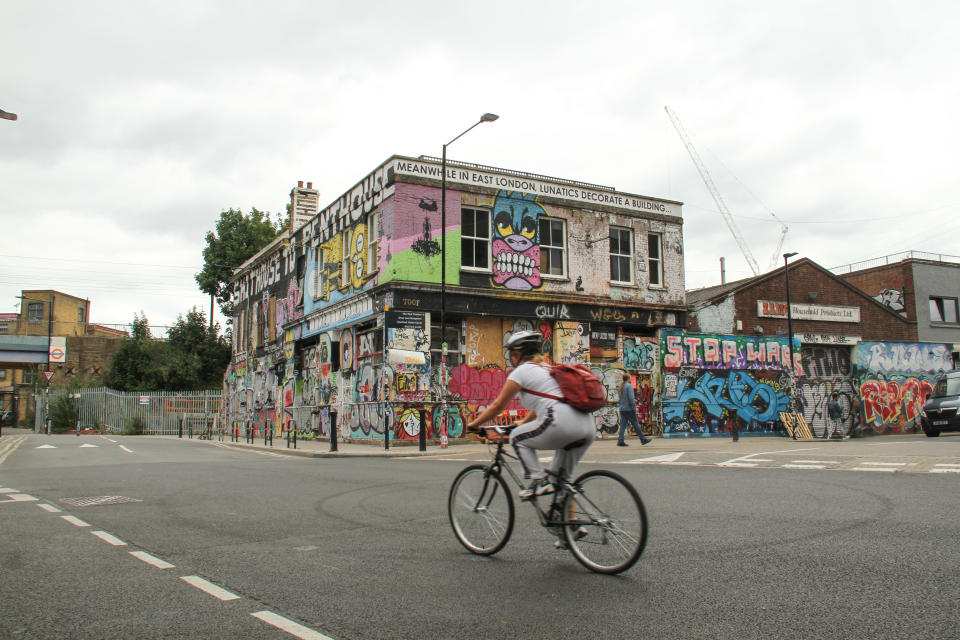  A cyclist ride past a derelict building on Hepscott Rd, Hackney Wick.
Despite the reopening of �non-essential� shops, parks and some leisure facilities, numbers of shoppers were still lower than usual as the public opt to purchase online and work from home. (Photo by David Mbiyu / SOPA Images/Sipa USA) 
