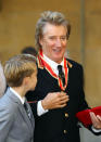 Singer Rod Stewart poses with his son Alastair at Buckingham Palace after receiving a knighthood, in London, Britain, October 11, 2016. REUTERS/Gareth Fulller/Pool